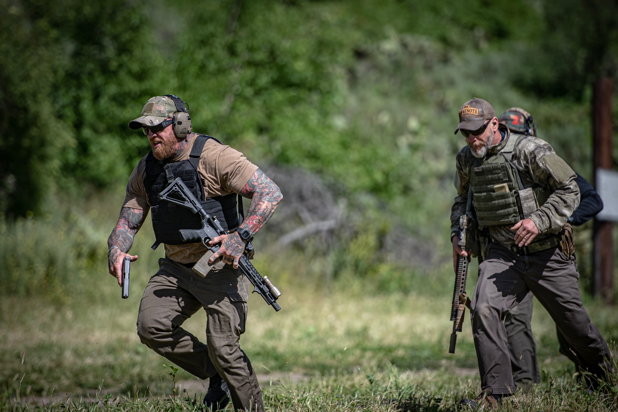 Professionals practicing tactical skills at an outdoor range